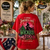 Red cotton t-shirt featuring a witch, green castle, fireworks, and American flag graphic with text I Love America And Wicked Too.!