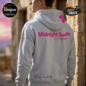 Light grey pullover hoodie with hot pink Midnight Sun Zara Larsson text and hibiscus flower graphic on back.!
