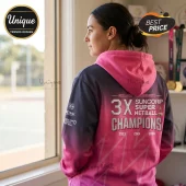 Woman wearing a pink and dark grey ombre Adelaide Thunderbirds hoodie with 3x Suncorp Super Netball champions graphics.!