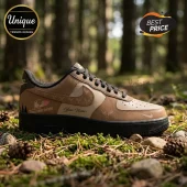 Custom brown leather sneaker featuring Adelaide Thunderbirds logo, deer silhouette graphics, and black rubber sole.!