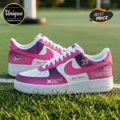 Custom Adelaide Thunderbirds netball sneakers in white and pink with 3X champions branding on a grass court background.!