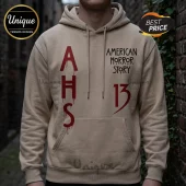 Beige cotton pullover hoodie featuring red dripping AHS lettering and American Horror Story logo with number 13 text.!