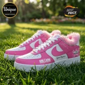 Custom pink and white leather sneakers with faux fur trim, cursive script, and MDB star logo on grass background.!