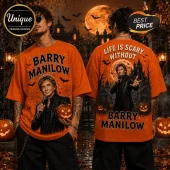 Barry Manilow Life Is Scary Without Halloween T-Shirt in orange featuring a spooky mansion, pumpkin, and singer graphic.