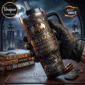 Engraved Batman The Dark Knight 87th anniversary stainless steel tumbler with straw held by a hand in black leather gloves.!