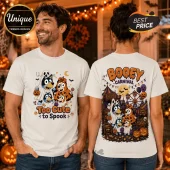 Bluey Family Too Cute To Spook Halloween T-Shirt showing character graphics on front and a carnival scene on the back.