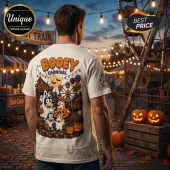 Bluey Family Too Cute To Spook Halloween T-shirt showing Bluey characters in costumes at a carnival with pumpkins.