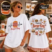 White crewneck t-shirt featuring Burger King logo, heartbeat line, and fast food icons with I have a Burger King addiction.!