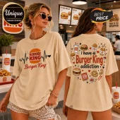 Beige cotton t-shirt with Burger King logo and heartbeat graphic on front and fast food menu prints on back.!