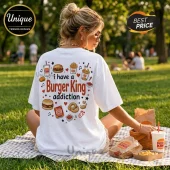 White crewneck t-shirt featuring back print with Burger King graphics, including food icons and text reading addiction.!