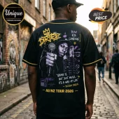 Black baseball jersey featuring Dizzee Rascal graphic, microphone, Bow E3 London text, and 2026 tour details in yellow.!