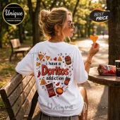 White oversized t-shirt featuring a Doritos addiction graphic with snack bags, salsa, queso, and chili peppers on the back.!