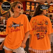 Orange cotton t-shirt featuring Doritos logos and snack graphics. Front shows heartbeat line, back says Doritos addiction.!