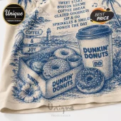 Dunkin Donuts Coffee and Donuts Limited Edition T-Shirt featuring blue ink illustrations of pastries on a beige fabric.