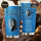 Blue stainless steel tumbler featuring The Eagles band logo, eagle skull graphic, and tracklist for Greatest Hits album.!