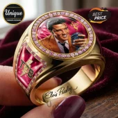 Gold ring featuring a portrait of Elvis Presley, pink crystal rim, and TCB lightning bolt logo on a maroon background.!