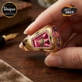 Gold Elvis Presley ring featuring TCB logo, pink side stones, and an oval portrait of Elvis holding a microphone.!