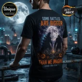 Godzilla vs Kong Halloween 2026 black t-shirt featuring silhouettes of monsters, a full moon, and carved jack-o-lanterns.