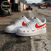 Haas F1 Team White Custom Nike Air Force 1 sneakers with red swoosh, TGR branding, racing numbers, and US flag detail.