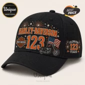 Harley-Davidson 123rd Anniversary black baseball cap with motorcycle, American flag, fireworks, and text graphics.