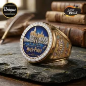 Harry Potter 20th anniversary gold championship-style ring with Hogwarts castle, blue inlay, and diamond-studded border.!