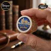 Gold Harry Potter 25th anniversary ring with blue enamel, Hogwarts castle relief, and circular diamond accent border.!