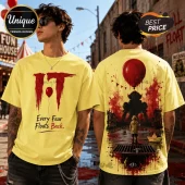 Yellow graphic t-shirt featuring Pennywise from IT on back and red balloon logo with text Every Fear Floats Back on front.!