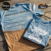 Blue Jimmy Eat World concert t-shirt featuring Bleed American 25th anniversary tour dates on a wood background.!