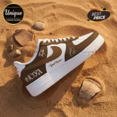 Customized white and brown leather sneaker with Your Name text, Joya branding, and signatures on a sandy background.!