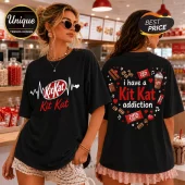 Black cotton t-shirt featuring front and back KitKat candy bar graphics with a heartbeat line and text print.!