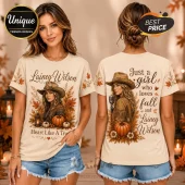Lainey Wilson Cowgirl Autumn Leaves T-Shirt featuring a country singer graphic, orange pumpkins, and fall foliage print.
