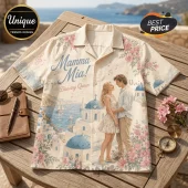 Mamma Mia themed beige button-up shirt featuring a couple, Greek coastal architecture, pink flowers, and musical notes.!