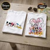 Mickey Mouse and Friends White Cotton T-Shirt set featuring printed illustrations of Disney characters on folded fabric.