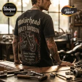 Man wearing black acid-wash graphic t-shirt featuring Motörhead and Harley-Davidson logo, motorcycle, and fire imagery.!