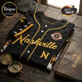 Nashville baseball jersey in black with gold dragon scale pattern, yellow piping, white buttons, and an N emblem.!