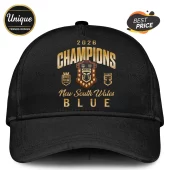 Black baseball cap featuring gold 2026 Champions text, NSW Blues rugby shield, and Ampol logo on a plain background.!