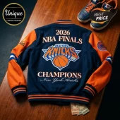 New York Knicks 2026 NBA Finals Champions varsity jacket with navy blue wool body, orange sleeves, and embroidered logos.!