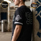 Man wearing a black pinstripe baseball jersey with 96 on the back and a World Series patch on the sleeve.!