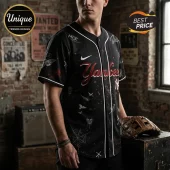 Black New York Yankees baseball jersey with white pinstripes, MCR text, skull, spider web, and red paint splatter graphics.!