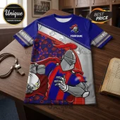 Newcastle Knights Blue Red Mascot T-Shirt with custom name area, knight helmet graphic, and patterned fabric detail.