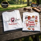 Two white cotton t-shirts on a wooden table featuring Panda Express logos, a heartbeat graphic, and food illustrations.!