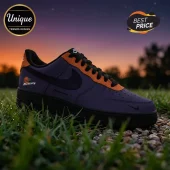 Custom Nike Air Force 1 sneaker in purple and orange with Mercury branding on a grass background at sunset.!