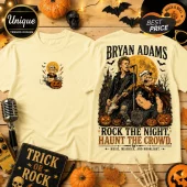Popeye x Bryan Adams Cream Halloween T-Shirt featuring a graphic of the musician and Popeye with jack-o'-lanterns at night.