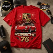 Red cotton t-shirt featuring a Porsche 911 graphic, gold emblem, checkered pattern, fireworks, and text Porsche 76.!