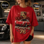 Red oversized t-shirt featuring a Porsche 911 graphic, the Porsche crest logo, fireworks, and the text Porsche 76.!