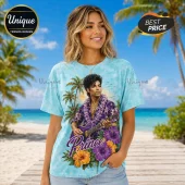Prince Hawaiian Purple Floral T-Shirt features a portrait of Prince with a guitar, surrounded by hibiscus and palm trees.
