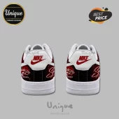 Custom Nike Air Force 1 sneakers with red rose print, black background, and white heel tabs displaying red Nike logos.!