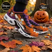 Snoopy Halloween Orange Air Max Plus Sneakers featuring Snoopy as a witch, spiderwebs, and pumpkins on asphalt.