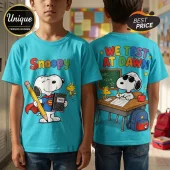 Turquoise t-shirt featuring Snoopy as Superman on front and Snoopy taking a school test on back with Woodstock.!