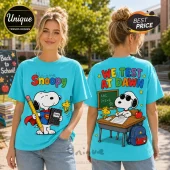 Bright turquoise t-shirt featuring Snoopy as Superman on the front and studying at a classroom desk on the back.!